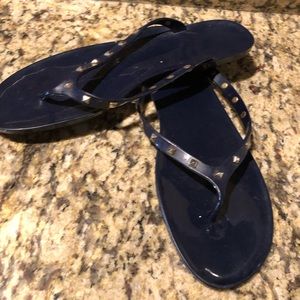 Navy blue jelly flip flops with gold studs